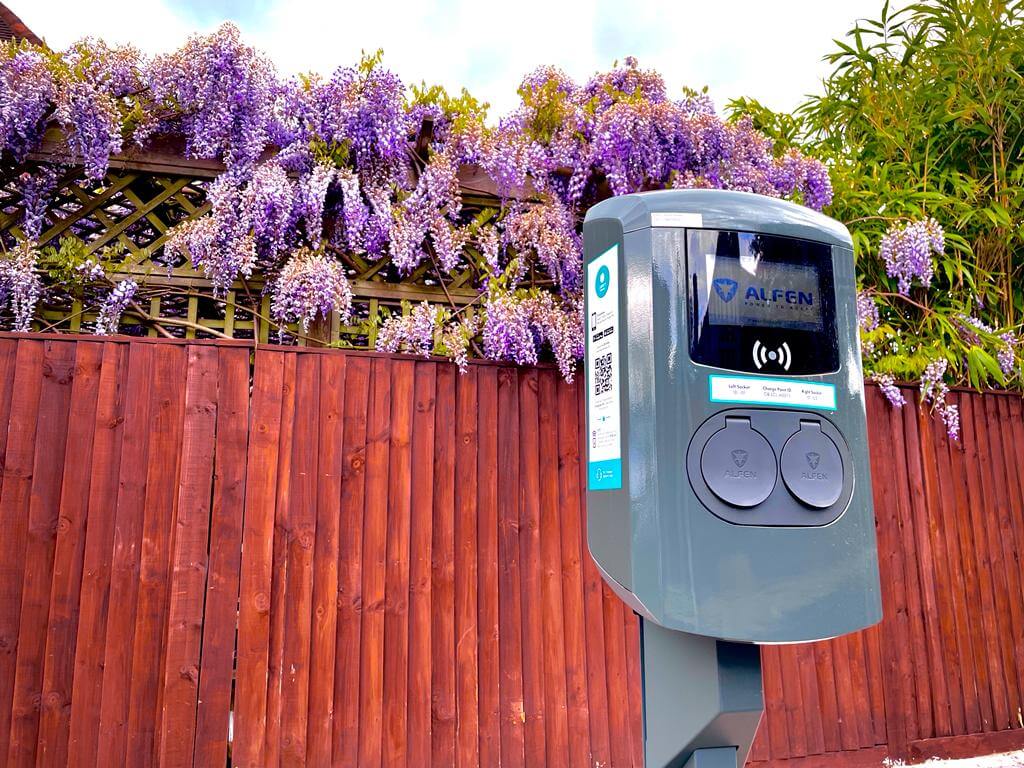 Charging point with flowers in the background